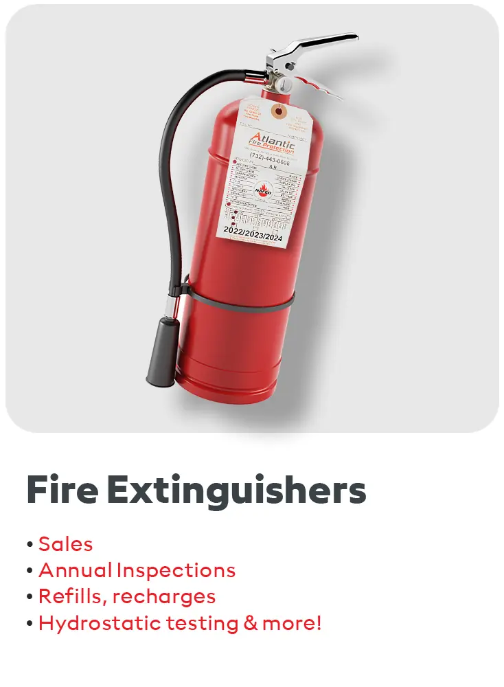 Red commercial fire extinguisher with inspection tag